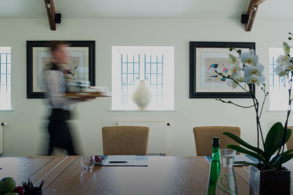 The Stable Suite boardroom with executive leather armchairs, climate control, and direct courtyard entrance