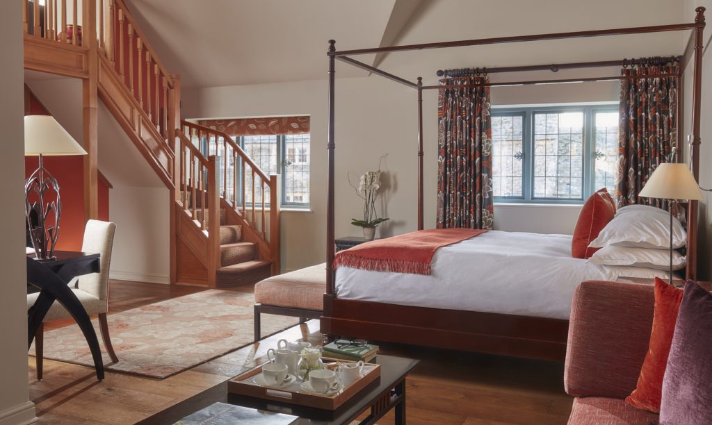 Luxury suite bedroom at Whatley Manor with super-king Harrison Spinks bed and elegant seating