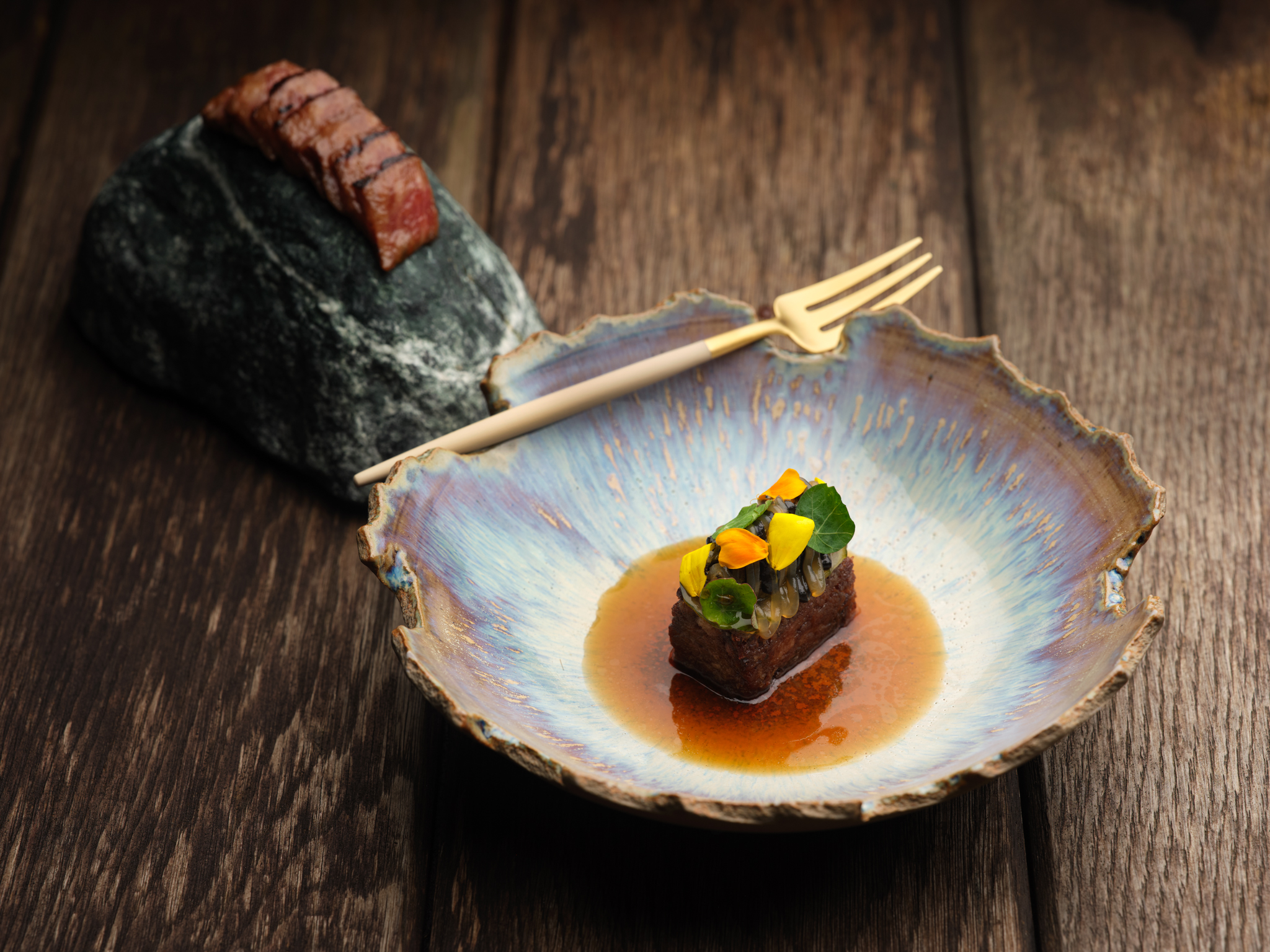 Aged British Wagyu beef course with glazed alliums and jus