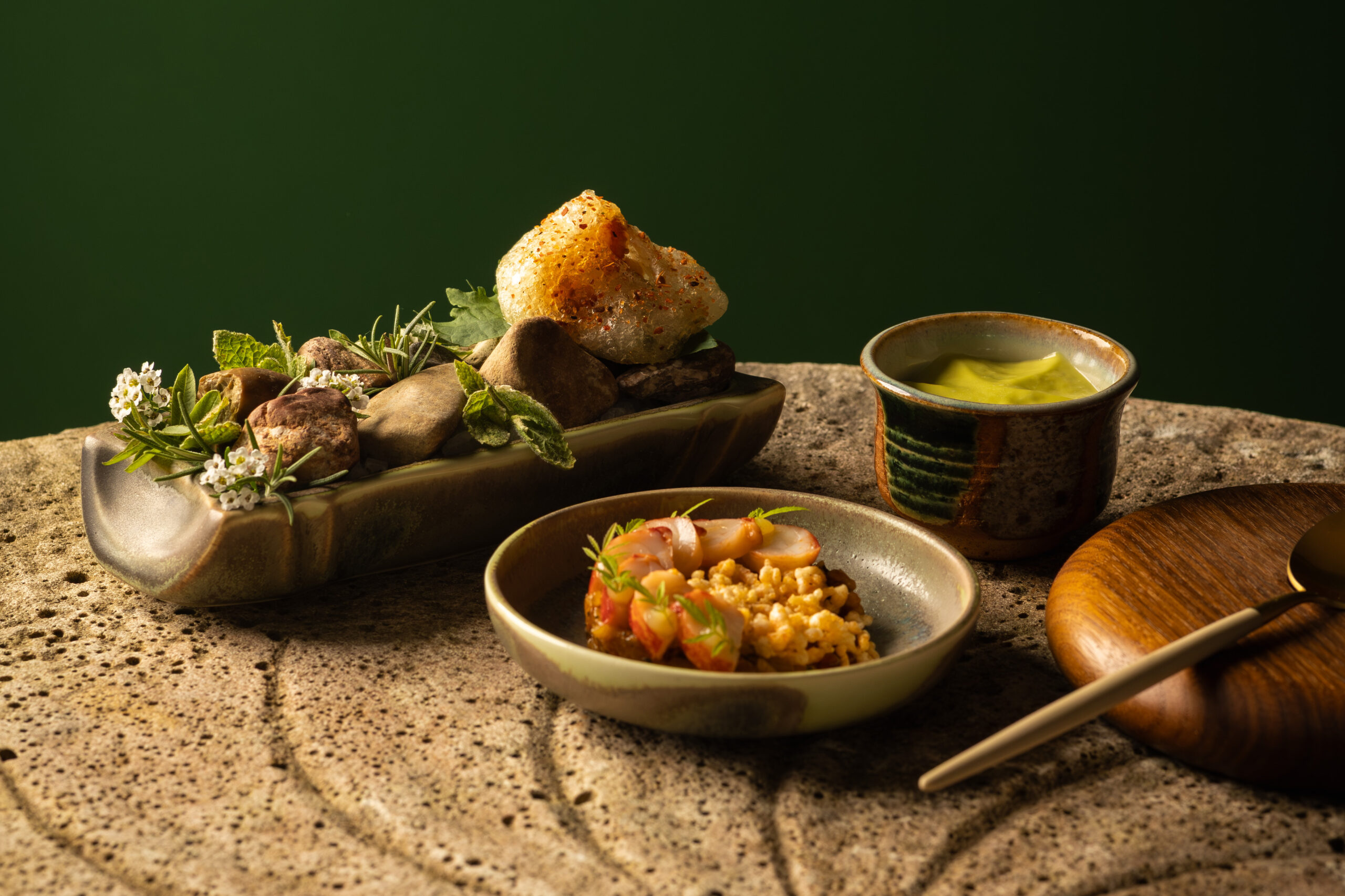 Artisanal Michelin-starred Cornish lobster course plated with estate garden herbs and delicate emulsion