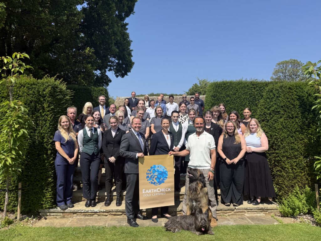 The Whatley Manor team celebrating EarthCheck Gold Certification in the manicured gardens